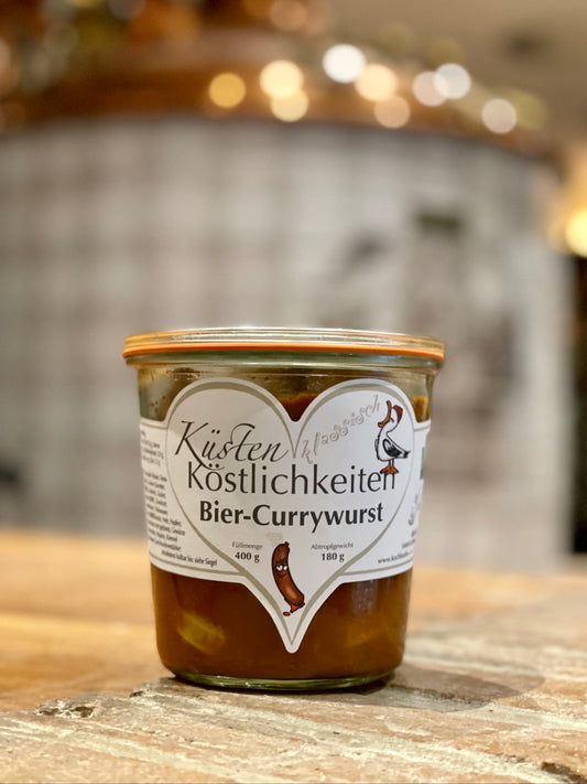 Das Bild zeigt ein Weck Glas der Küsten Köstlichkeiten mit Bier-Currywurst